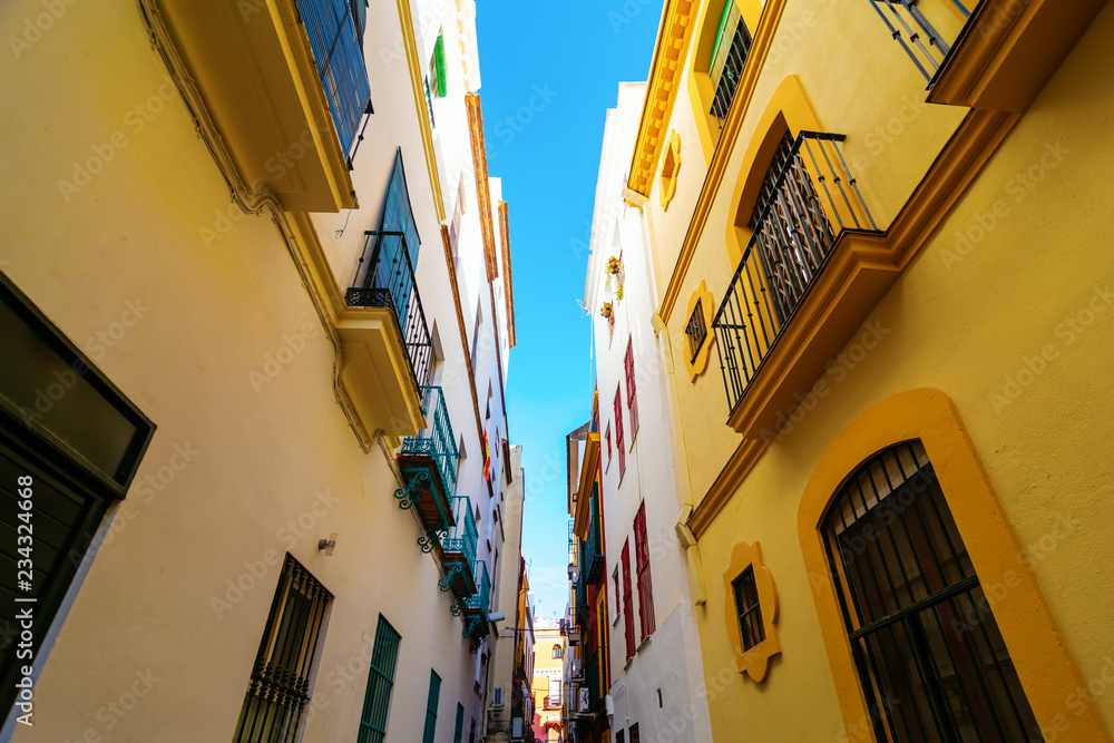alley in the old town of Seville, Spain