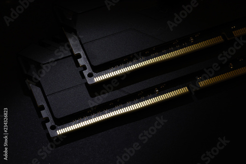 Close-up of Computer RAM (Random Access Memory) module on black background.