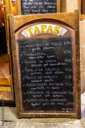 menu outside of a tapas bar in Seville, Spain