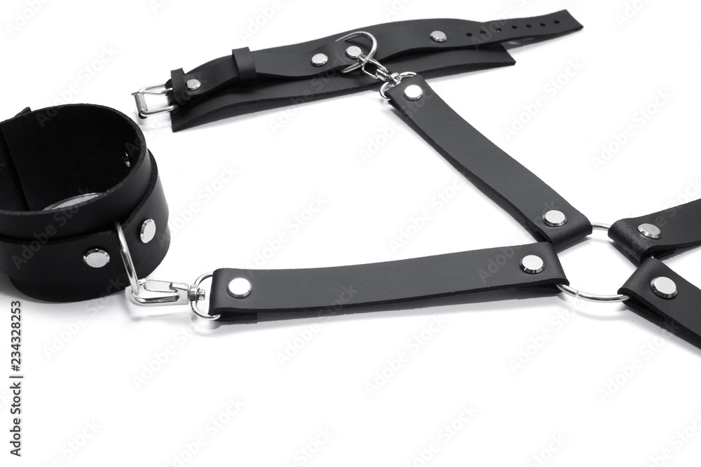 Obraz premium Black leather handcuffs isolated on white background. BDSM Kit
