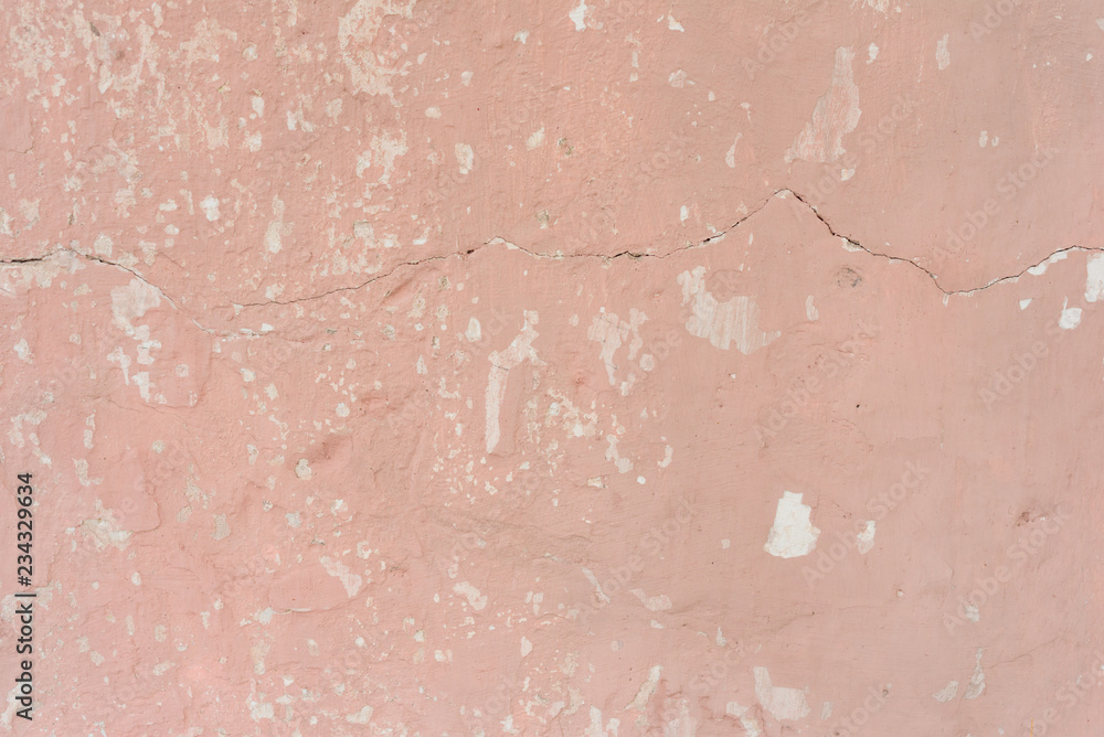 Fototapeta premium Wall fragment with scratches and cracks. It can be used as a background
