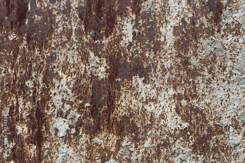 Old paint on a rusty metal surface. Grunge texture. For background and design.