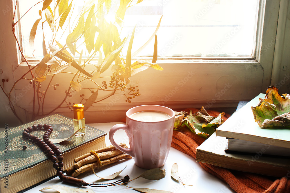  Autumn still life for muslim tradition m. cup of coffee,  orange scarf and maple leaves, holy book quran and rosary, siwak, oud perfume  on wooden background. the concept of cozy autumn. - obrazy, fototapety, plakaty 