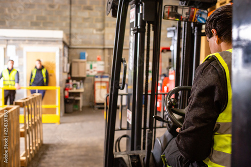 Practical forklift training course. Industrial background.