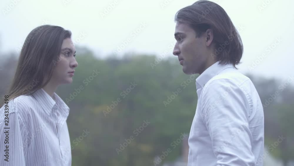 Female is angry and slaps a male ourdoors Showdown Family quarrel Female is angry and slaps a male ourdoors Showdown Family quarrel