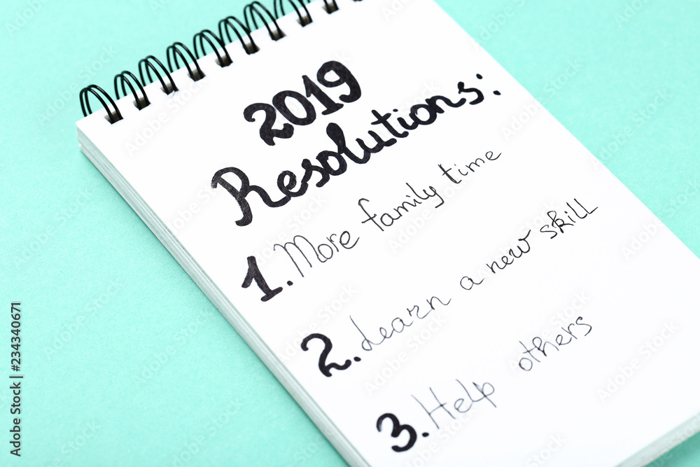 Obraz premium Inscription 2019 resolutions in notepad on mint background
