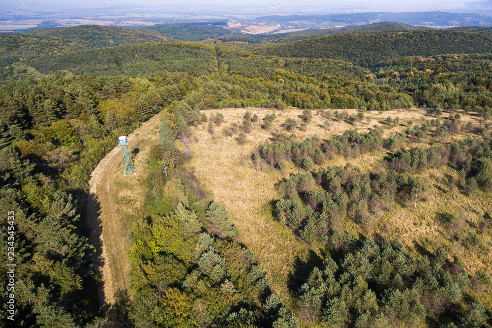 Aerial photography of the eastern border of the European Union. Mountains Carpathians. Part of the Ukrainian-Polish border. Observation tower at the bottom left
