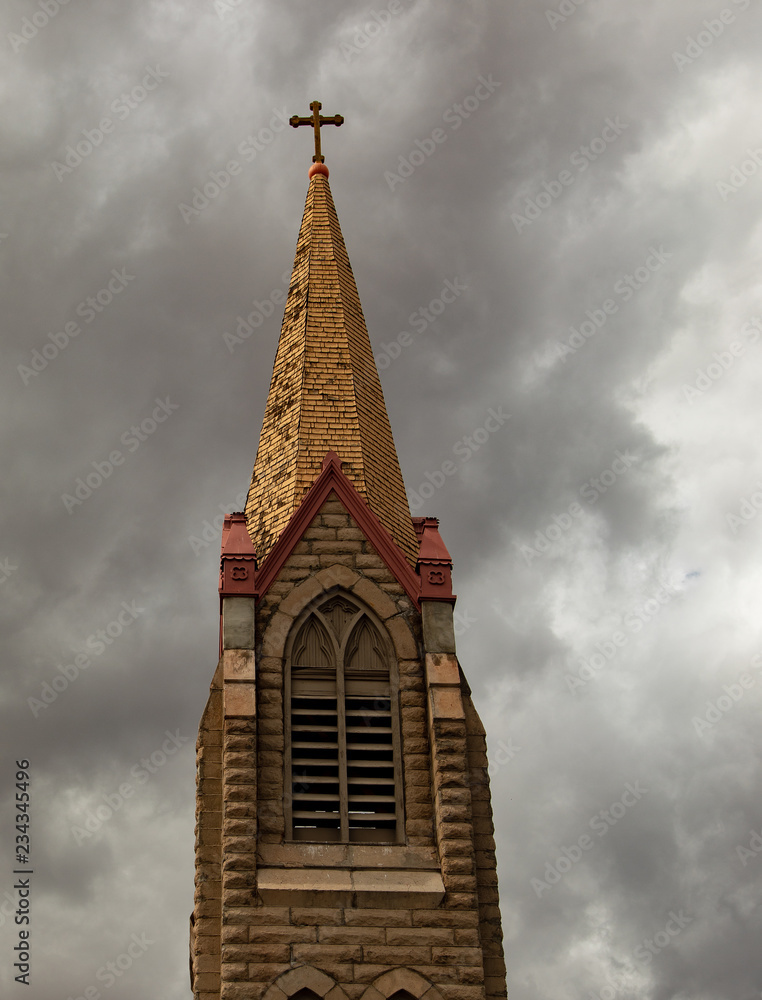 Church tower with gray cloudy sky Church tower with gray cloudy sky