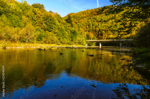 Bieszczady Mountains, Rajskie Poland, San river, view on streem in sunny autumn day. 