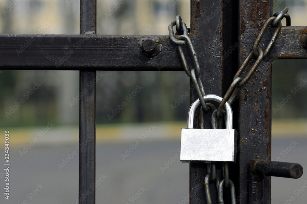 Gate Is Locked With Chain And Padlock Rusted Lock On A Metal Chain 