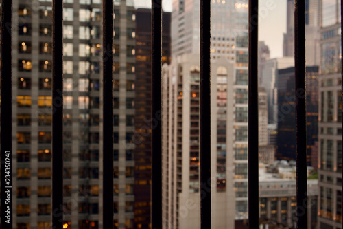 View of modern office buildings in downtown Chicago at twilight from bars