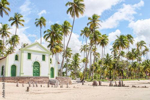 Igreja na praia com coqueiros no Pernambuco Brasil © Cleber