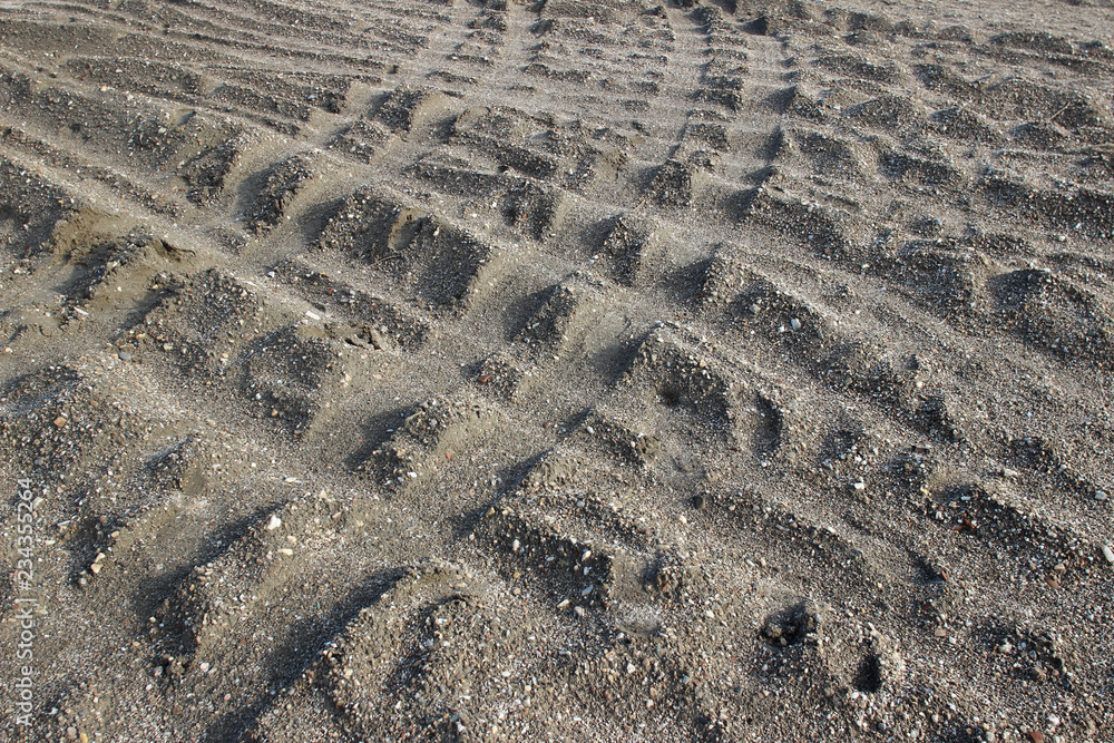 Tire tyre tracks on beach sand surface texture horizontal detail abstract Tire tyre tracks on beach sand surface texture horizontal detail abstract