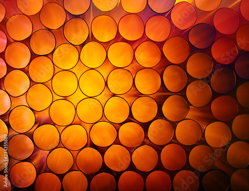 Abstract orange colorful background of stack pipes