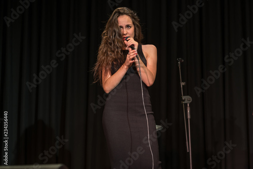 Pretty brunette girl singing