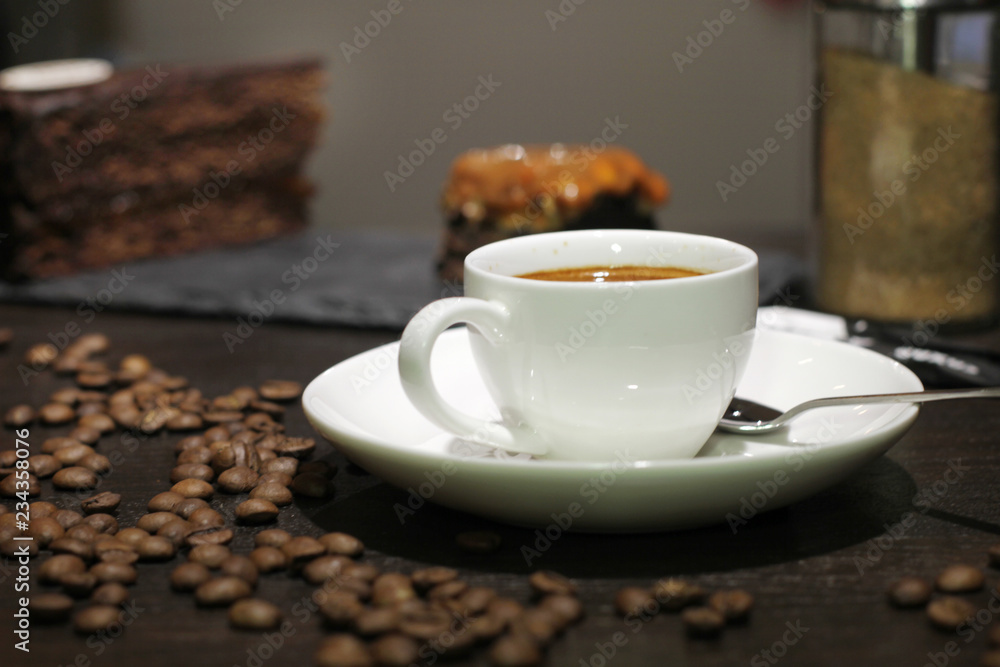 Cup of coffe with cake and beans Cup of coffe with cake and beans
