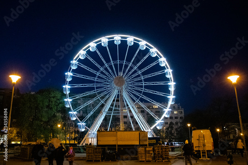 Biggest Ferris wheel in Brno, Czech Republic in Moravske square during set up for Christmas event captured at night time