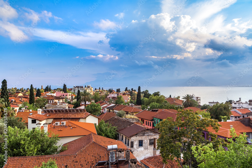 Landscape from the window to the roofs and the sea in the area of Kaleici, Antalya, Turkey