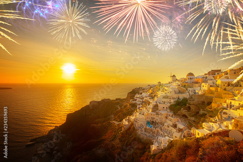 famouse sunset of Oia over Aegan sea, Santorini island with fireworks