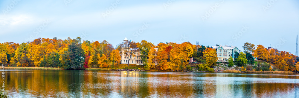 Panoramic view of Beautiful autumn landscape with yellow trees and Lake.Autumn season concept