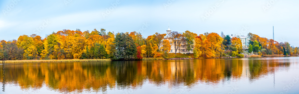 Panoramic Beautiful autumn landscape with yellow trees and sun. Colorful foliage in the park. Falling leaves natural background .Autumn season concept