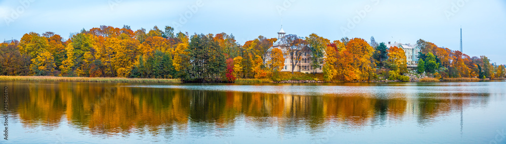 Panoromic view of Beautiful autumn landscape with yellow trees and Lake.Autumn season concept