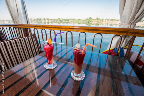 Seating on the sundeck of a river cruise boat with cocktails