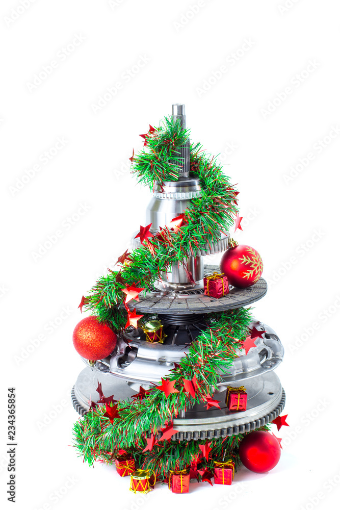 Abstract christmas tree of car parts on a white background. Decorated with Christmas toys, garland Abstract christmas tree of car parts on a white background. Decorated with Christmas toys, garland
