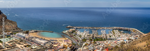 Panorama of Puerto Mogan beach and marina from hilltop in Puerto Mogan, Gran Canaria, Spain on 15 May 2013