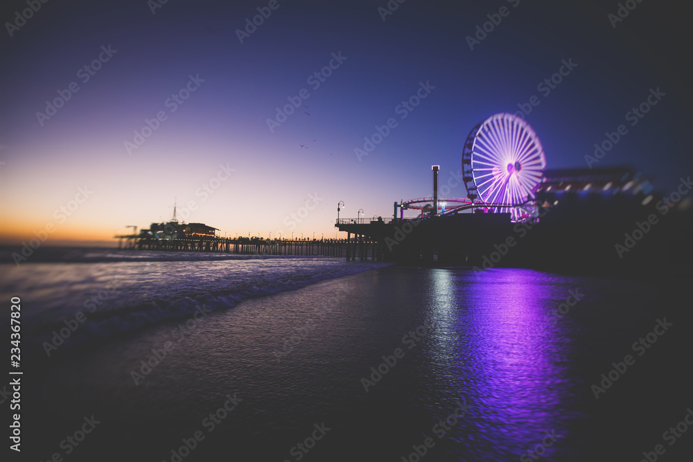 View of historic Santa Monica pier, with beach, amusement park, shops and restaurants, Los-Angeles, California, United States of America