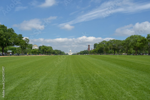 wide shot of path leading to the white house on a sunny spring day