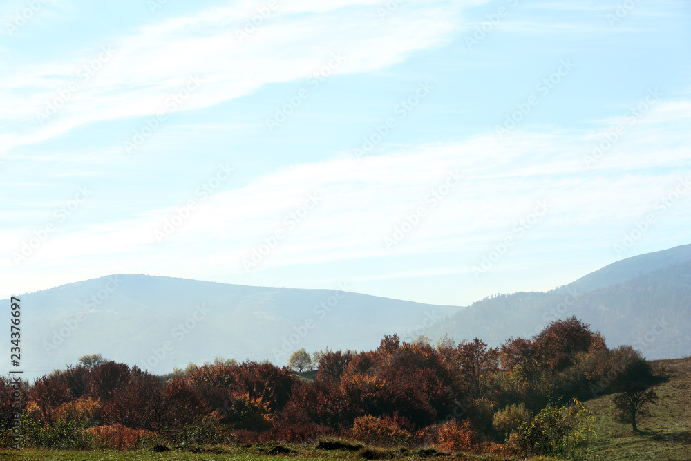 Fototapeta premium Beautiful landscape with blue sky over mountain slopes
