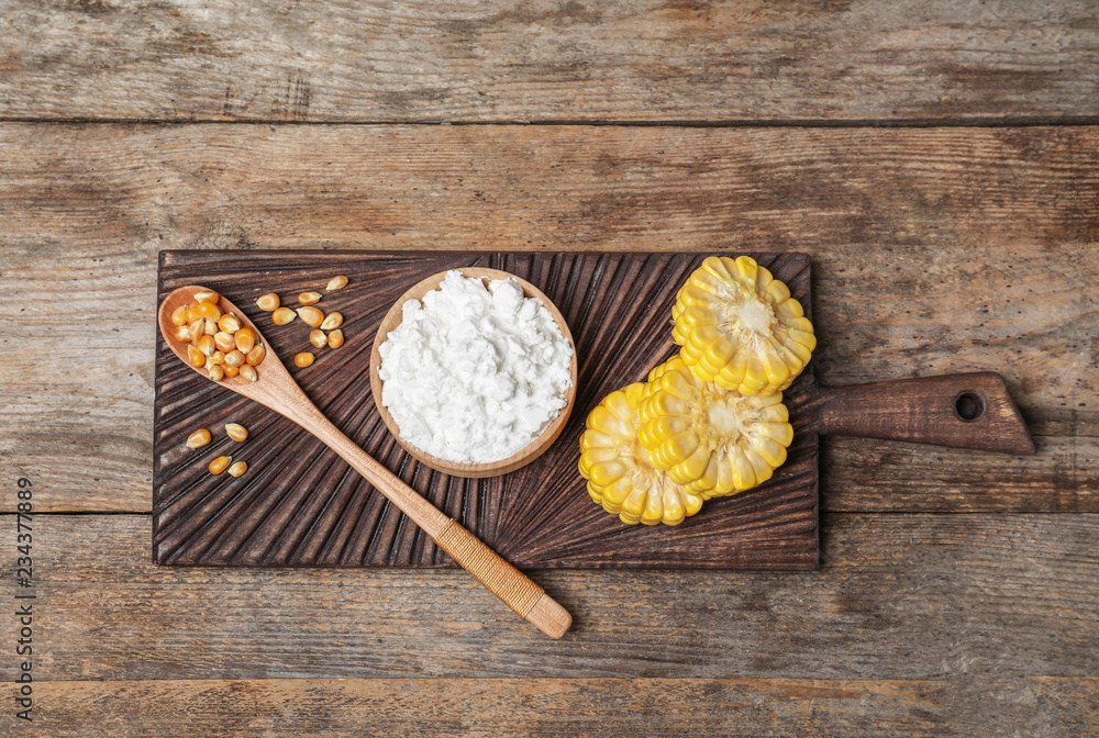 Flat lay composition with corn starch on wooden background Flat lay composition with corn starch on wooden background