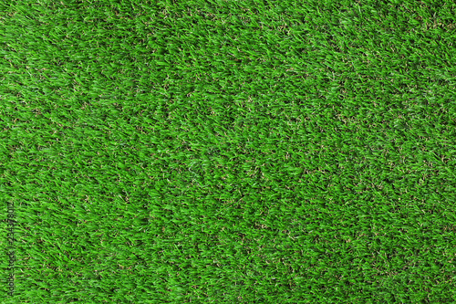 Artificial grass carpet as background, top view. Exterior element