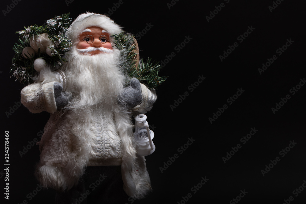 Close up of Santa Claus toy in winter gray style. Great gift for every home in December. Plenty of copy space to be creative with Close up of Santa Claus toy in winter gray style. Great gift for every home in December. Plenty of copy space to be creative with