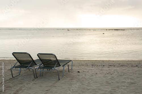 beach chair on the beach with sunset