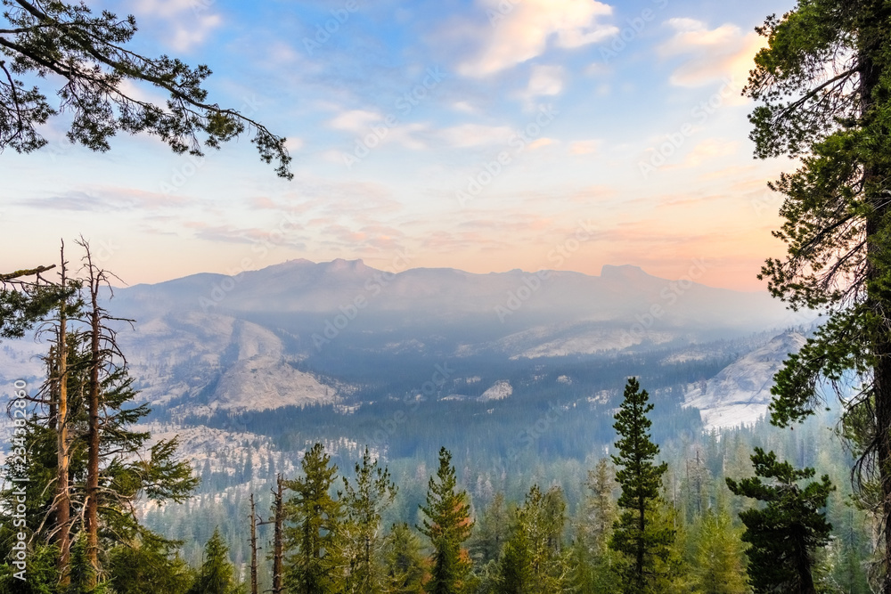 Sunrise landscape in Yosemite National Park; low visibility due to the smoke from the Ferguson Fire present in the air; California Sunrise landscape in Yosemite National Park; low visibility due to the smoke from the Ferguson Fire present in the air; California