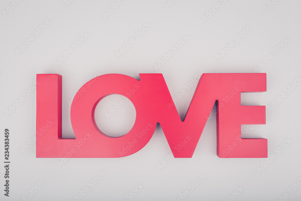 Red sign LOVE. Valentine day concept. Trendy minimalistic flat lay design background
