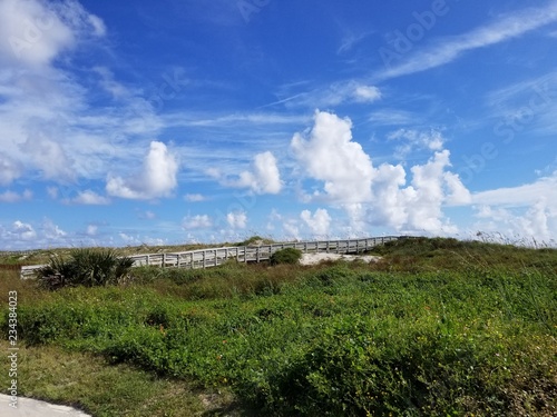 sandy beach with clouds