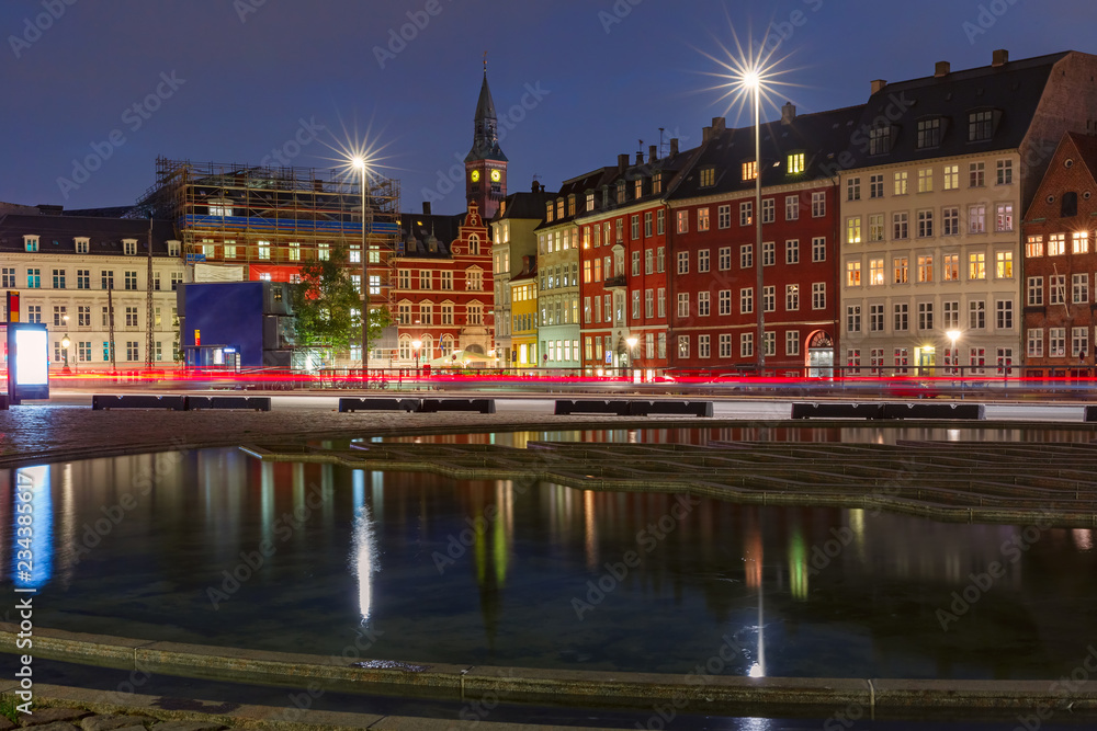 Bertel Thorvaldsen's Square, Copenhagen City Hall and colorful houses with their mirror reflection in reflecting pool at night, Copenhagen, capital of Denmark