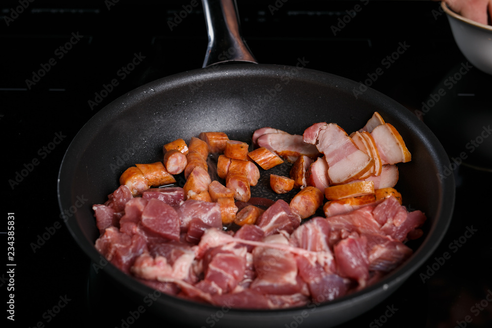 Frying pan with different kinds of meat Frying pan with different kinds of meat