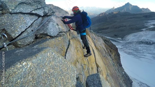 POV to mountaineer on dangerous track on expedition to Gran Paradiso summit on Italian Alps. View from helmet mount gopro camera
