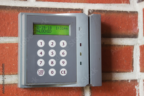 Unlocked card access machine on a brick wall
