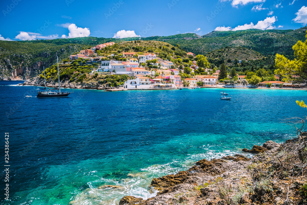 Beautiful blue bay in Assos village located on Kefalonia. Summer tourism vacation trip around Greece