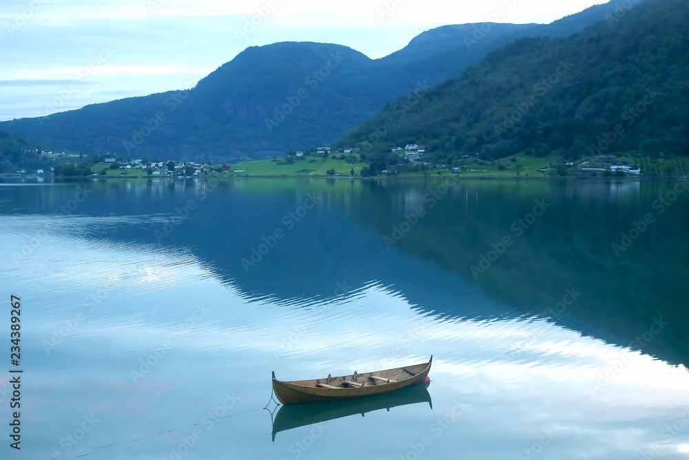 wooden boat on the lake