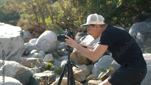 Male setting up camera and tripod to capture the beauty of nature in California National Park photo