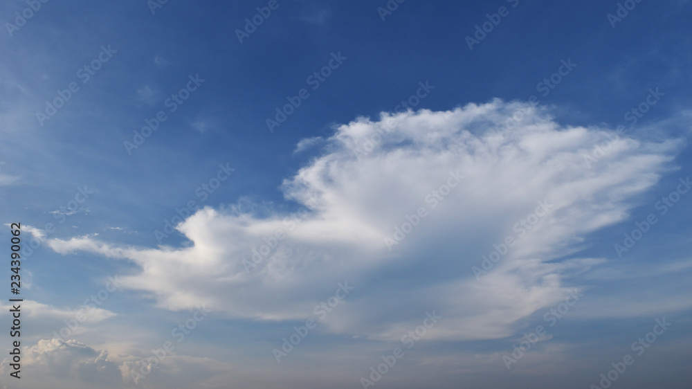 Cumulus cloud on beautiful blue sky , Fluffy clouds formations at tropical zone , Thailand