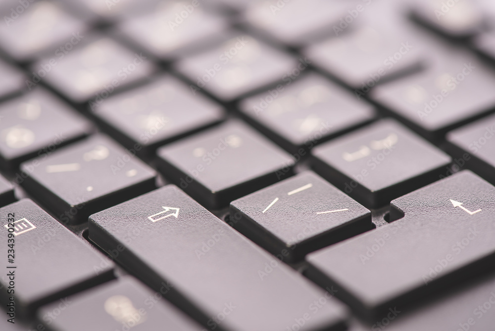 Macro keyboard keys, an angle view, soft background with copy space Macro keyboard keys, an angle view, soft background with copy space