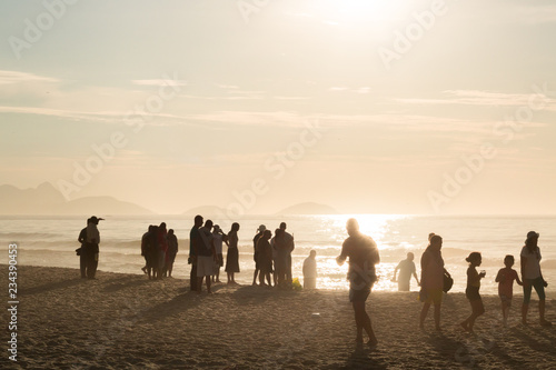 tourists enjoying sunrise on copacabana beach rio de janeiro brazil