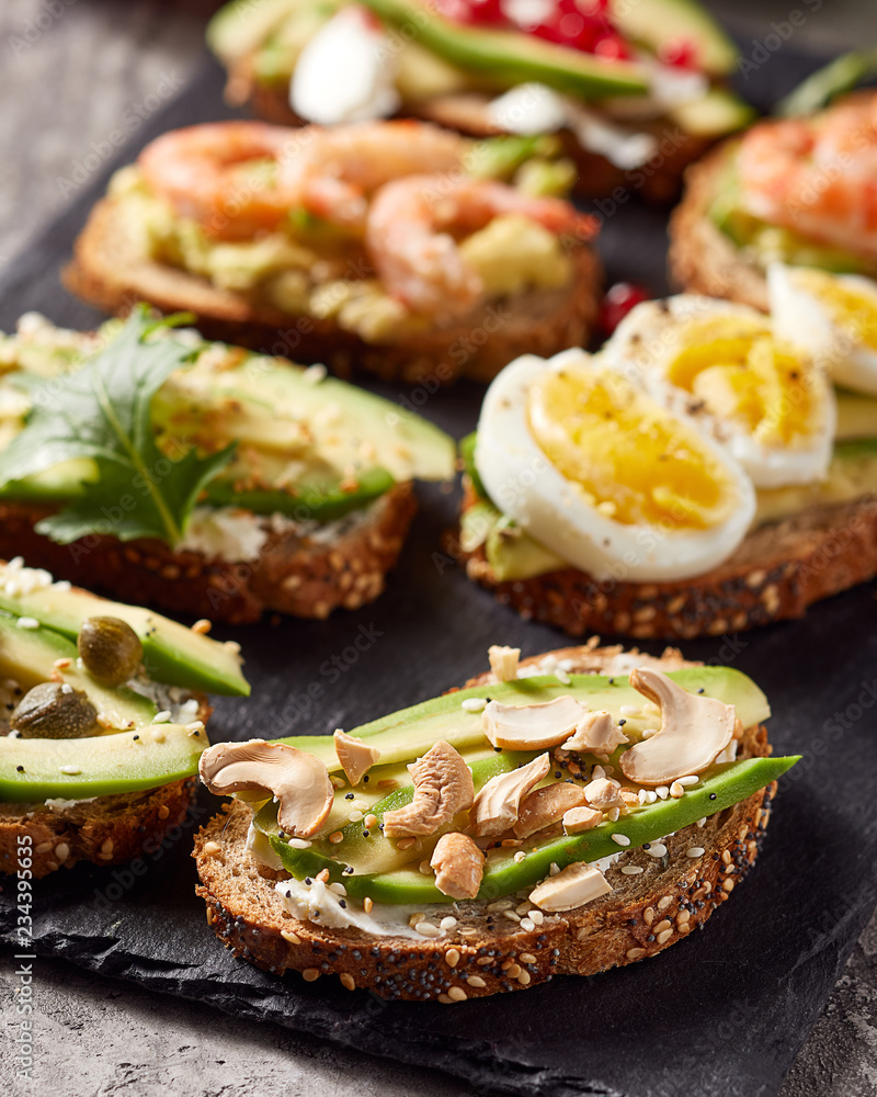 Close-up view of avocado toasts. Plant-based food Close-up view of avocado toasts. Plant-based food